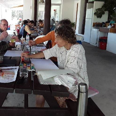 reatreat people painting on tables